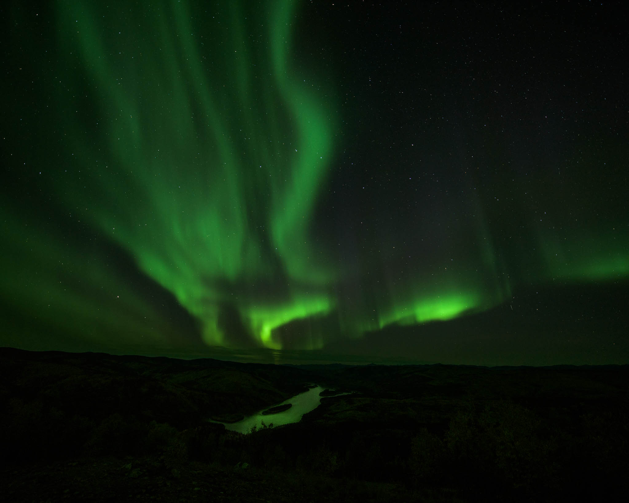 Yukon River lit up by the Northern Lights